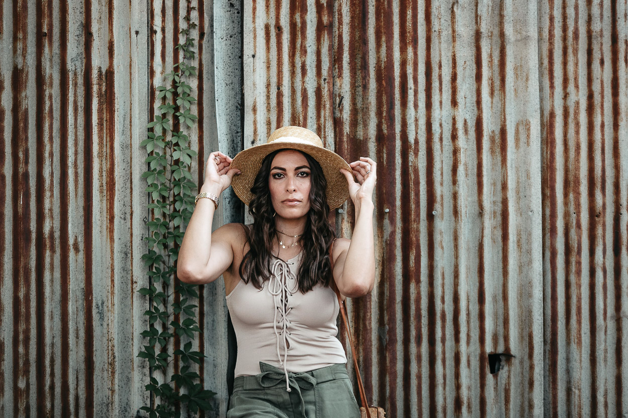 Amanda of AGlamLifestyle blog wears Tularosa lace up bodysuit with LOFT cargo pants