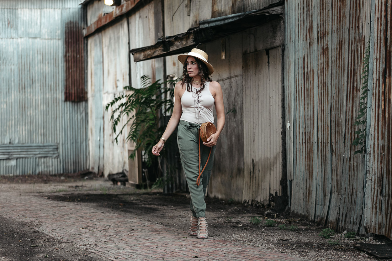 Easy Summer style includes a lace up bodysuit and cargo pants like Amanda of A Glam Lifestyle blog wears in Dallas