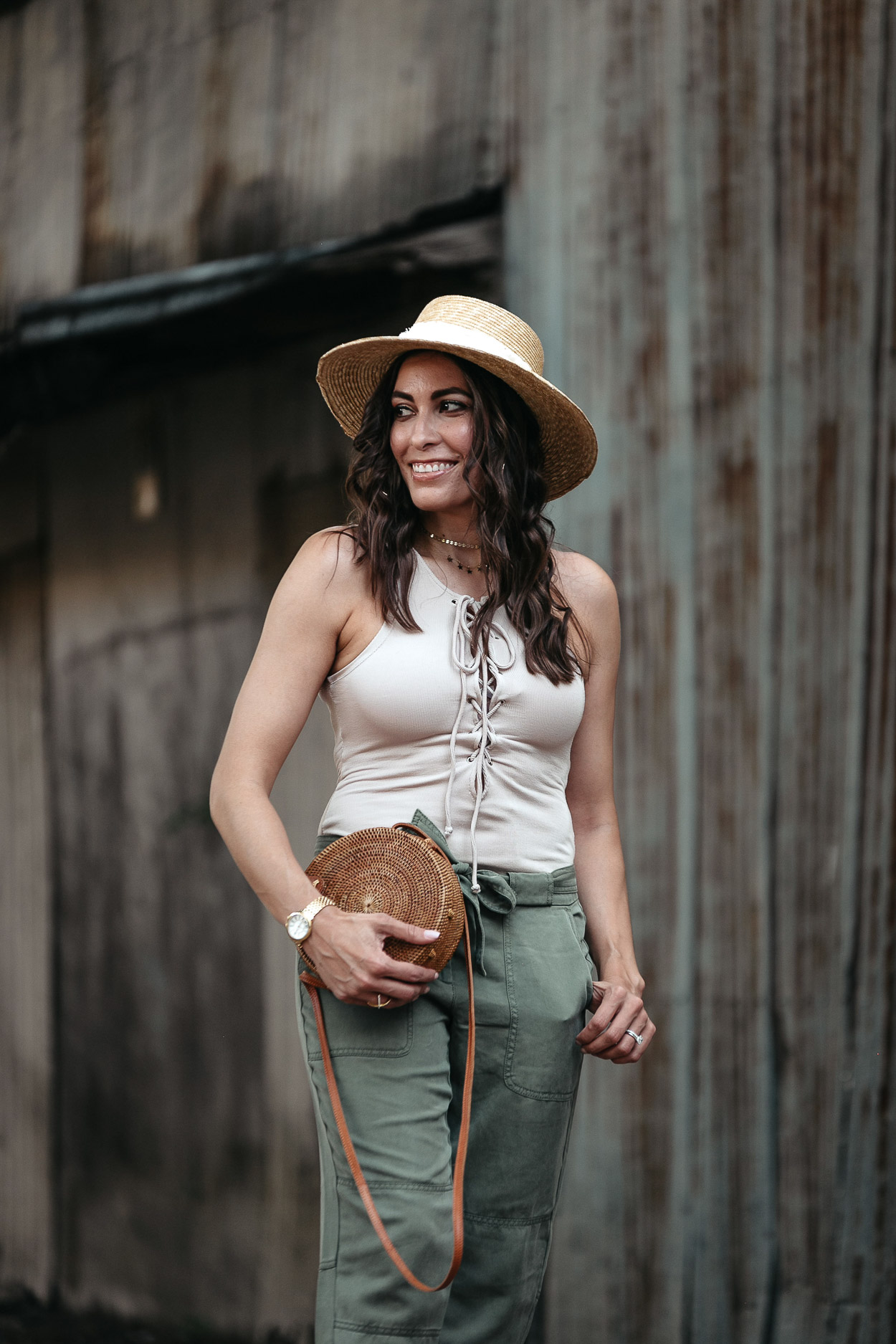 Nude lace up bodysuit is styled with tie waist cargo pants by fashion blogger Amanda of A Glam Lifestyle with round basket bag