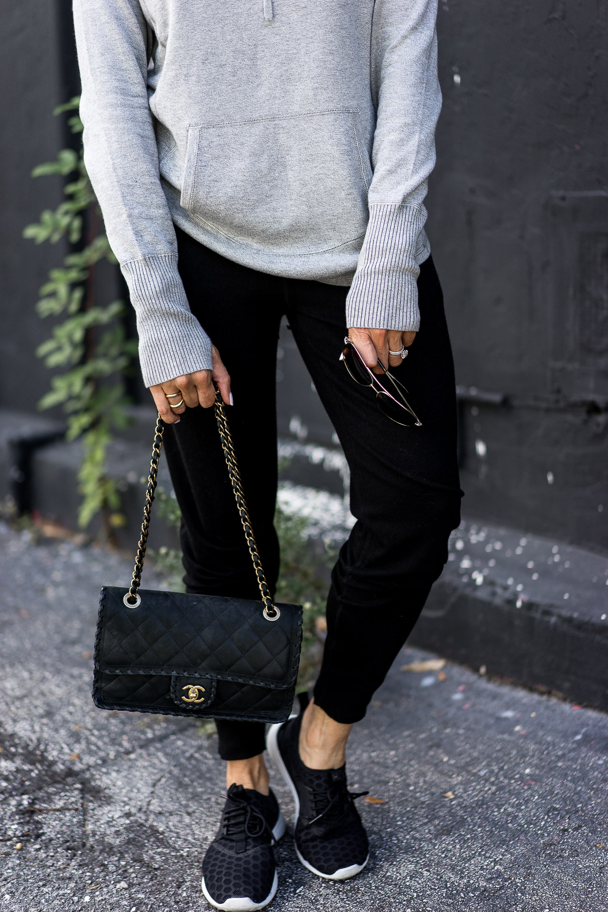 Leimere cashmere joggers review by A Glam Lifestyle blog who paired the affordable cashmere with her Chanel bag and Nike sneakers