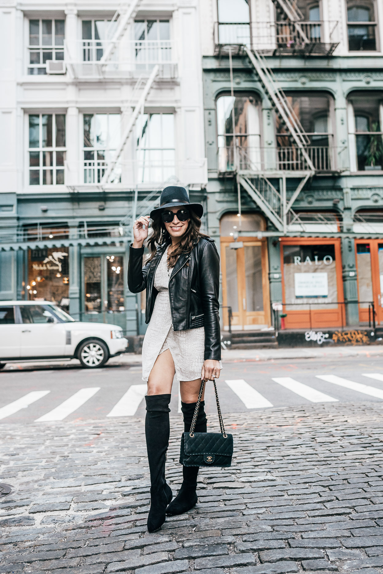 Gentle Fawn Elijah faux wrap dress is styled by AGlamLifestyle blogger Amanda with classic Chanel bag and Maje leather jacket during NYFW in Soho