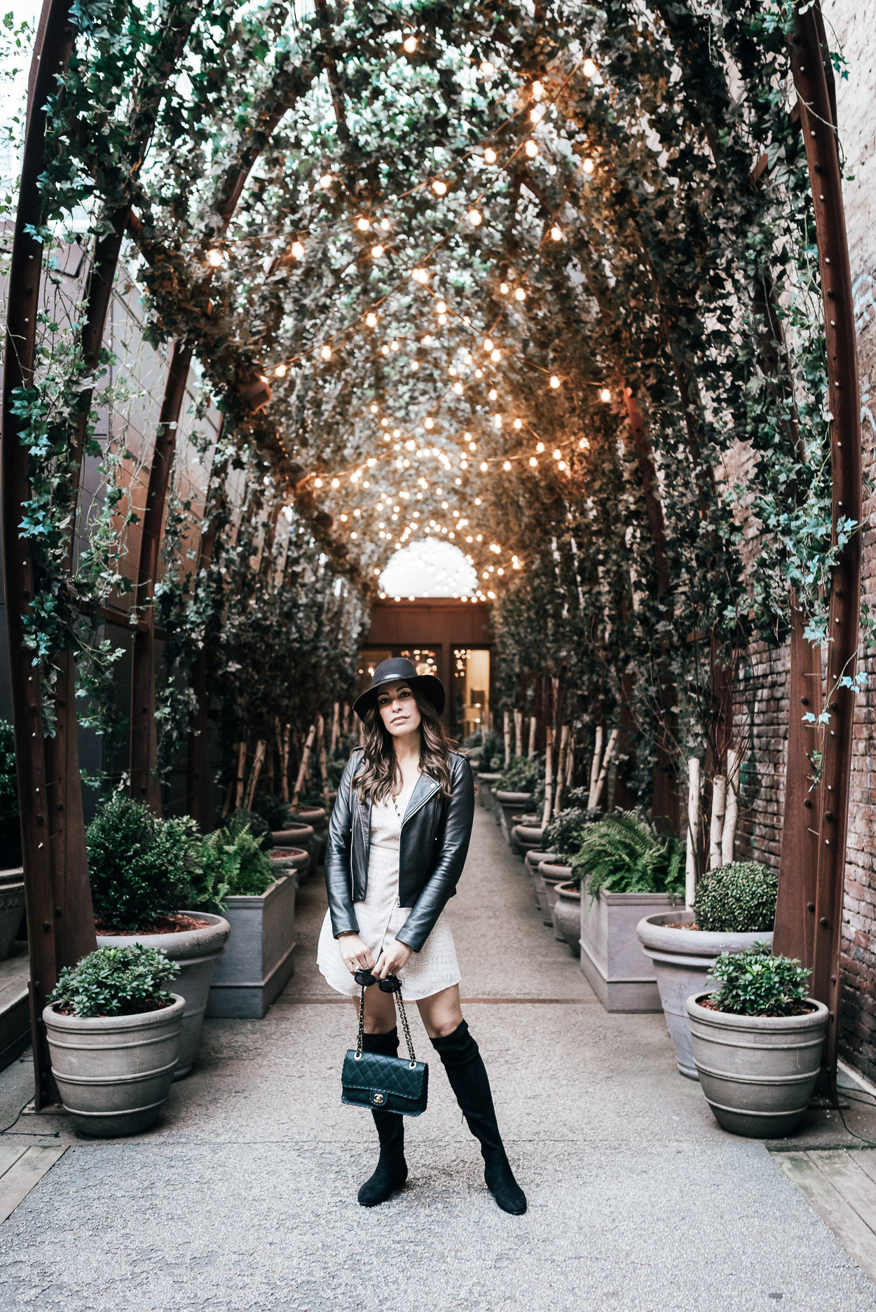 Gentle Fawn dress styled at Nomo Soho by blogger Amanda of A Glam Lifestyle with Maje black leather jacket and Joie over the knee boots during NYFW SS18