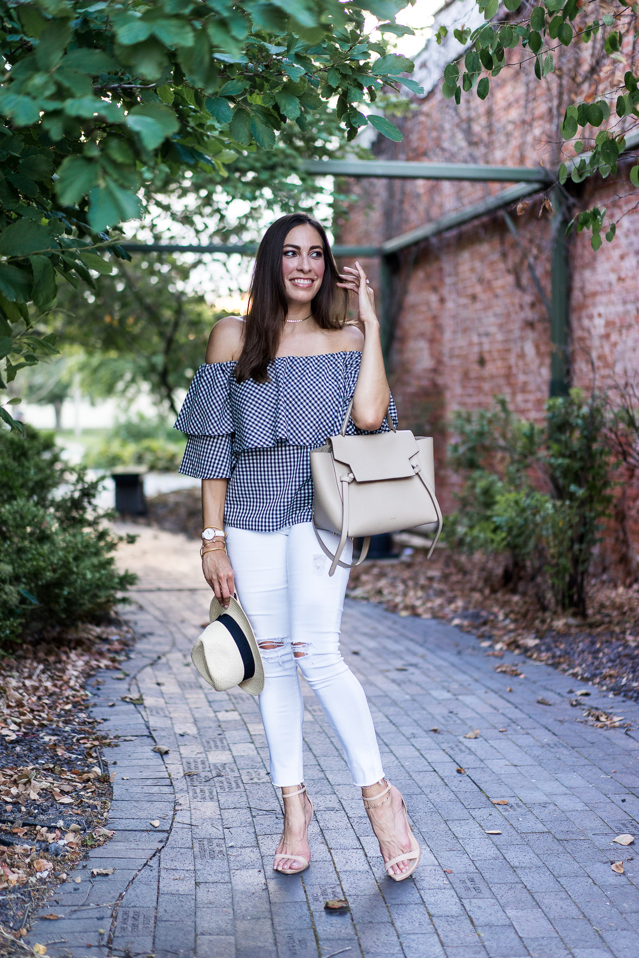 Pair this Wayf gingham top with white AG legging jeans and neutral accessories to transition your Summer style into Fall