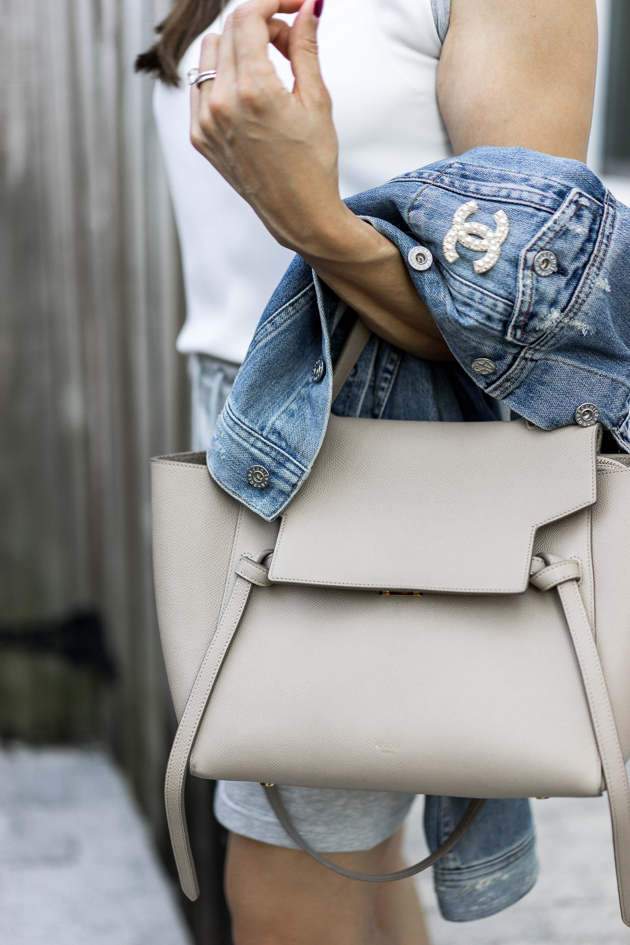 Casual chic accessories like a Celine belt bag and pearl Chanel pin go great with Anne Fontaine Casual clothes