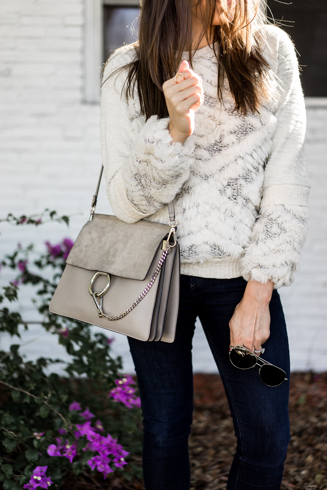 Amanda from A Glam Lifestyle blog wears an Anthropologie textured sweatershirt as one of her fave cozy sweaters