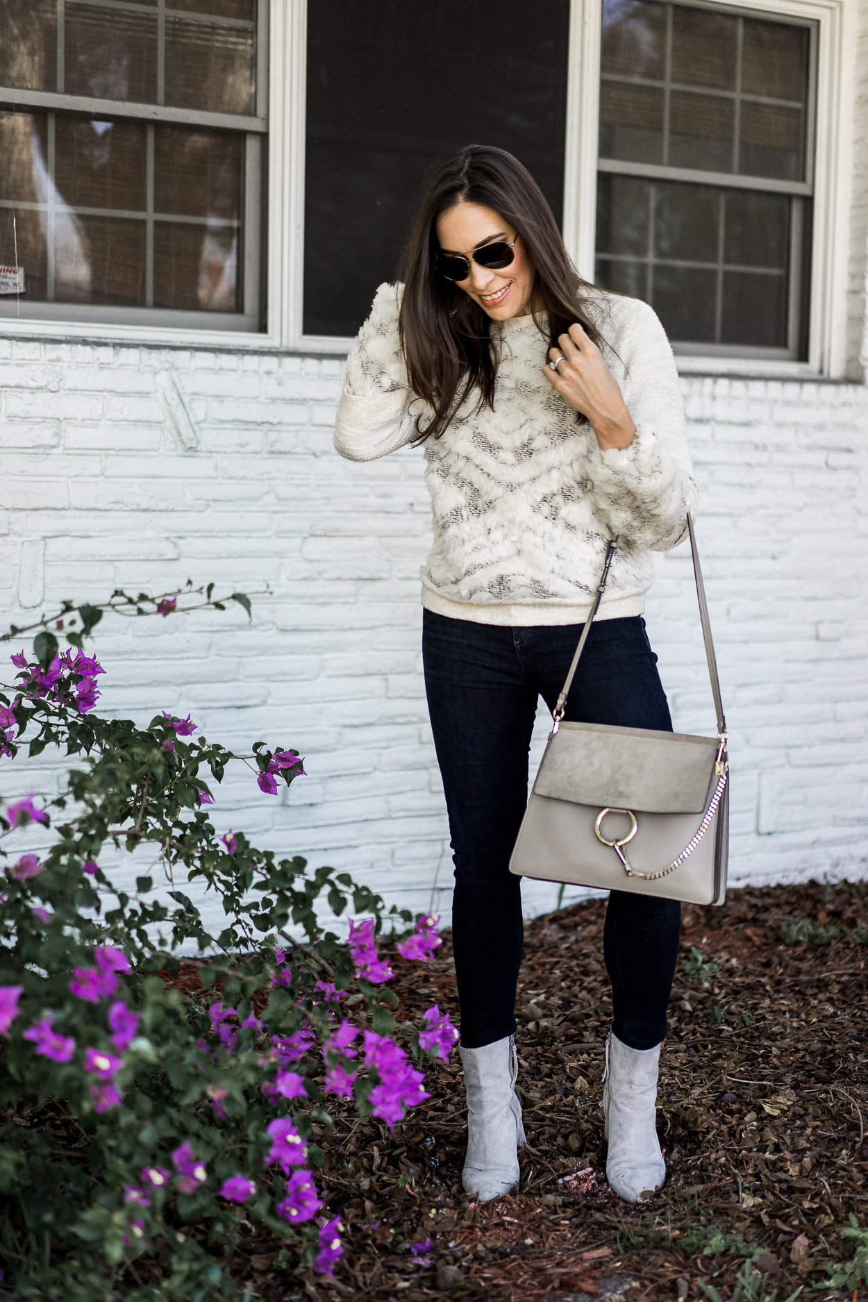 Amanda Champion where Anthropologie knit, jeans, and white boots