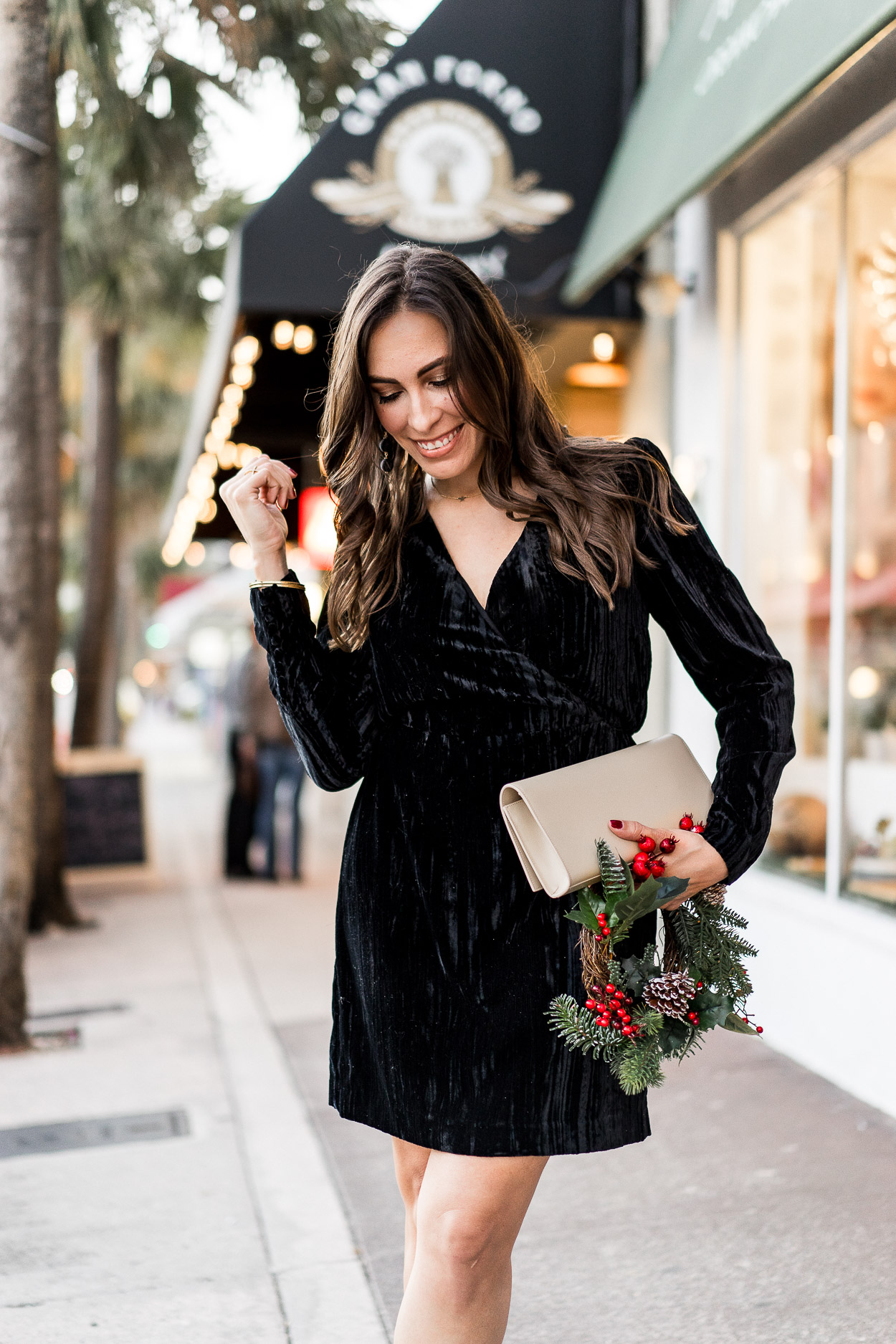 What to wear to a holiday party includes this gorgeous HM black velvet dress and nude clutch