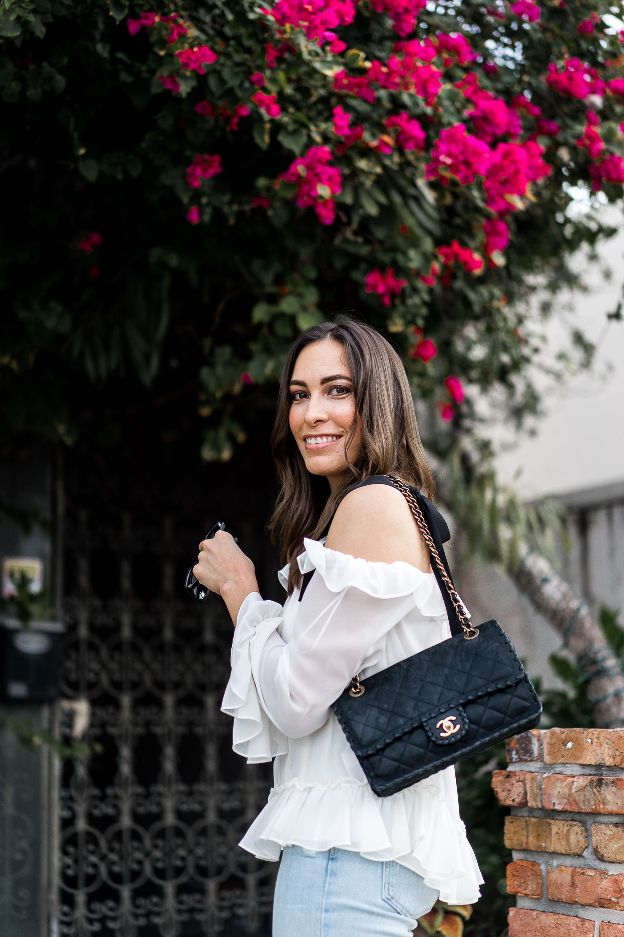 Cece ruffled blouse with classic Chanel bag