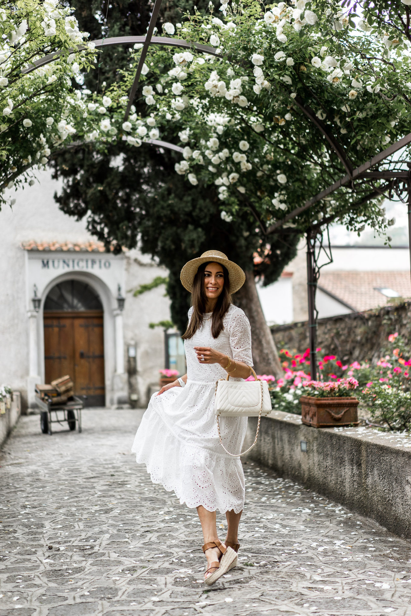 Amanda wears a Chicwish white eyelet dress