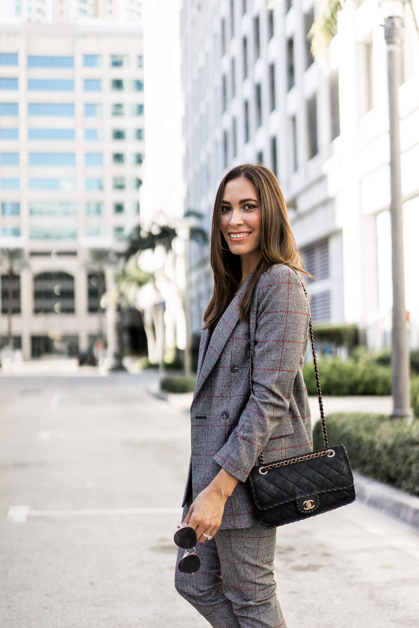 plaid power suit, is worn by Amanda with her M.Gemi pumps and classic Chanel bag