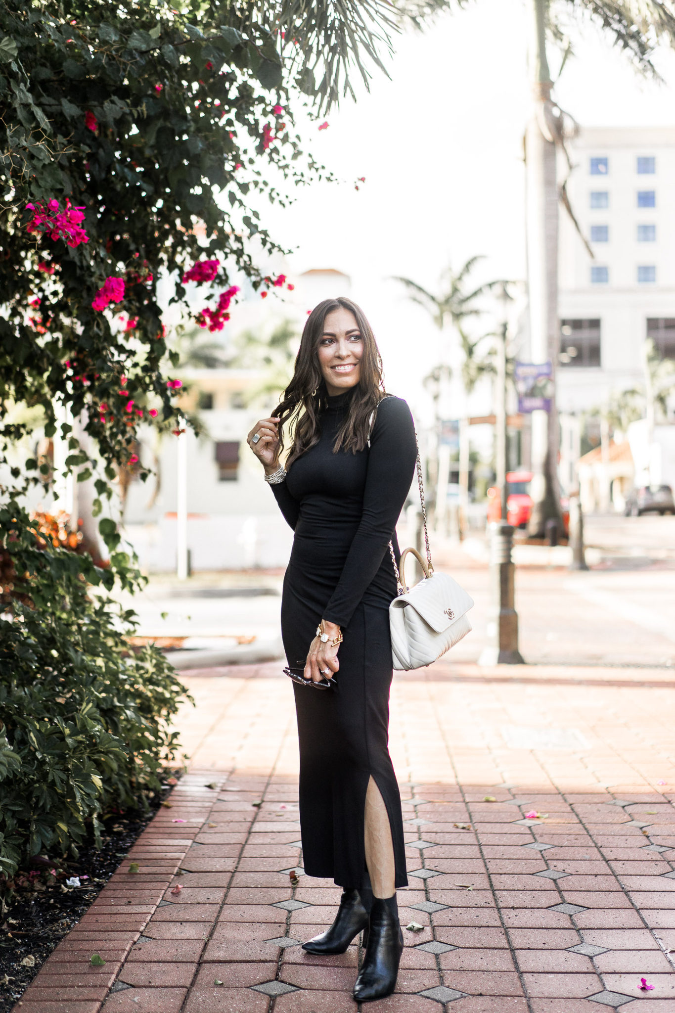 Amanda wears a Susana Monaco black sheath dress