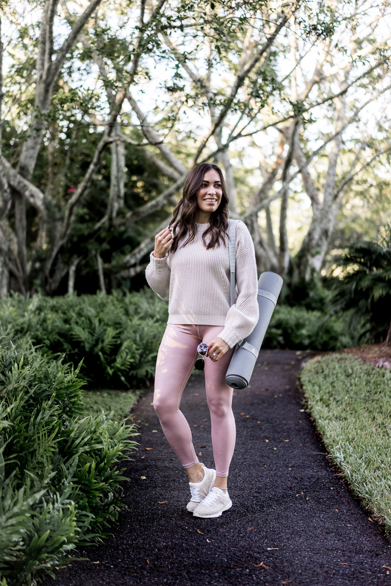 Amanda wears the elation shimmer athleta leggings with the cashmere lucca sweater for a cute athleisure outfit