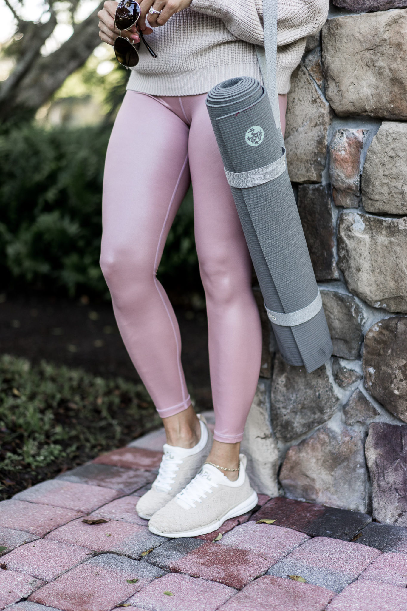 The neutral queen, Amanda of A Glam Lifestyle, wears her APL sneakers with her Elation Shimmer tights 