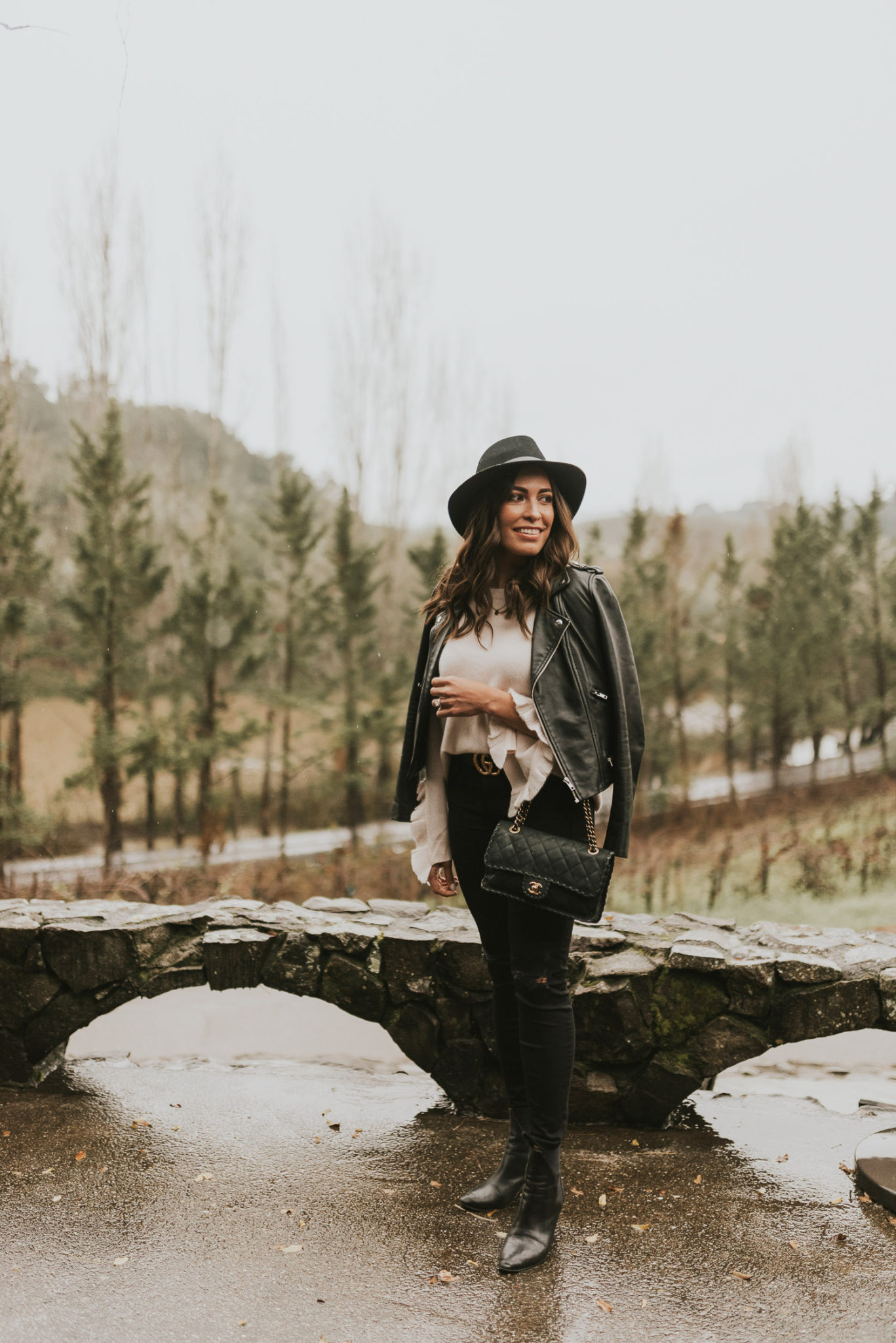 Amanda wears her blush ruffled cashmere sweater at Matrix Winery in Sonoma