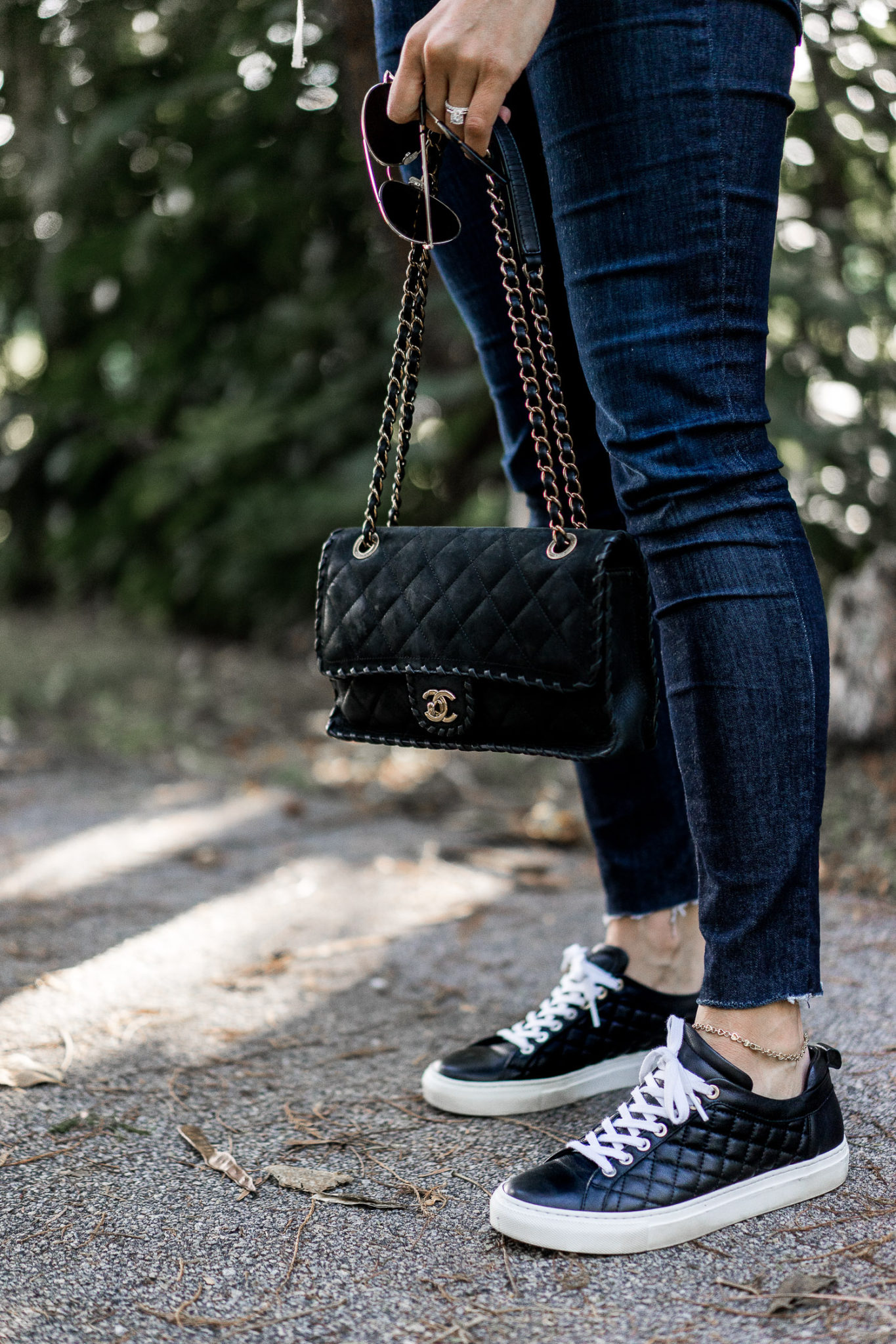 Amanda styles her M Gemi Palestra sneakers with her black Chanel bag and Rag and Bone denim.