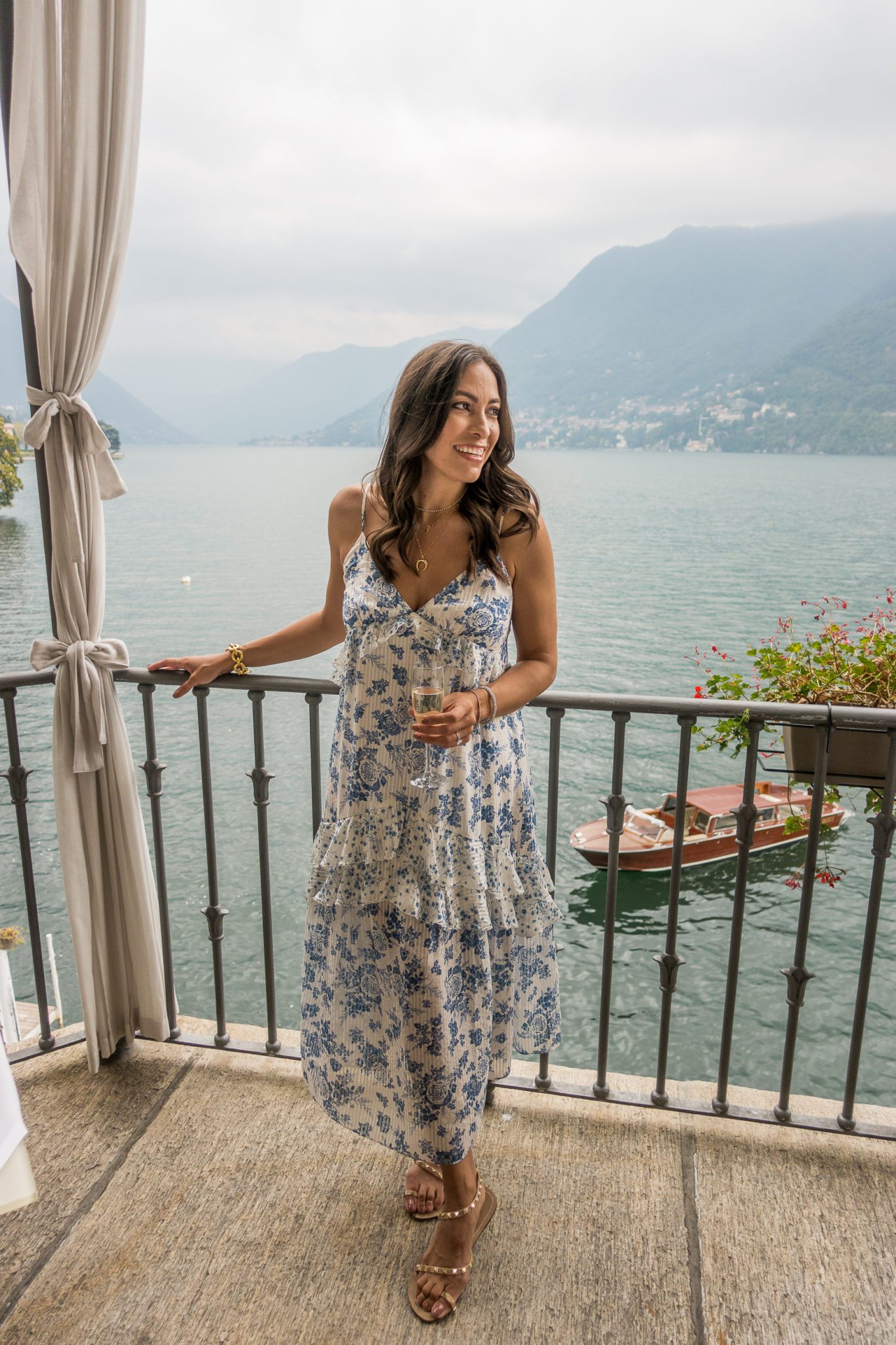 woman drinking wine and sharing Lake Como travel guide
